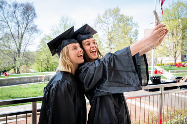 two Denison women taking a graduation selfie
